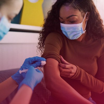 A woman getting a shot